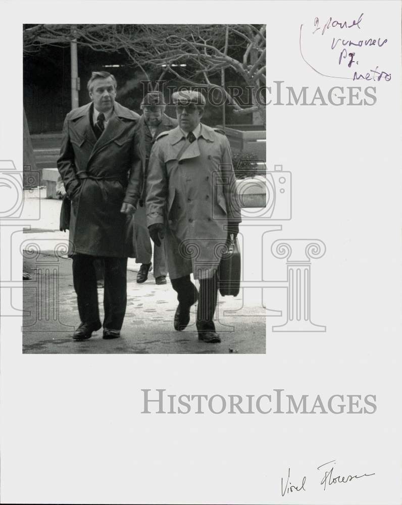 Press Photo Robert Woehrle walks with associates outside - ctca00993- Historic Images