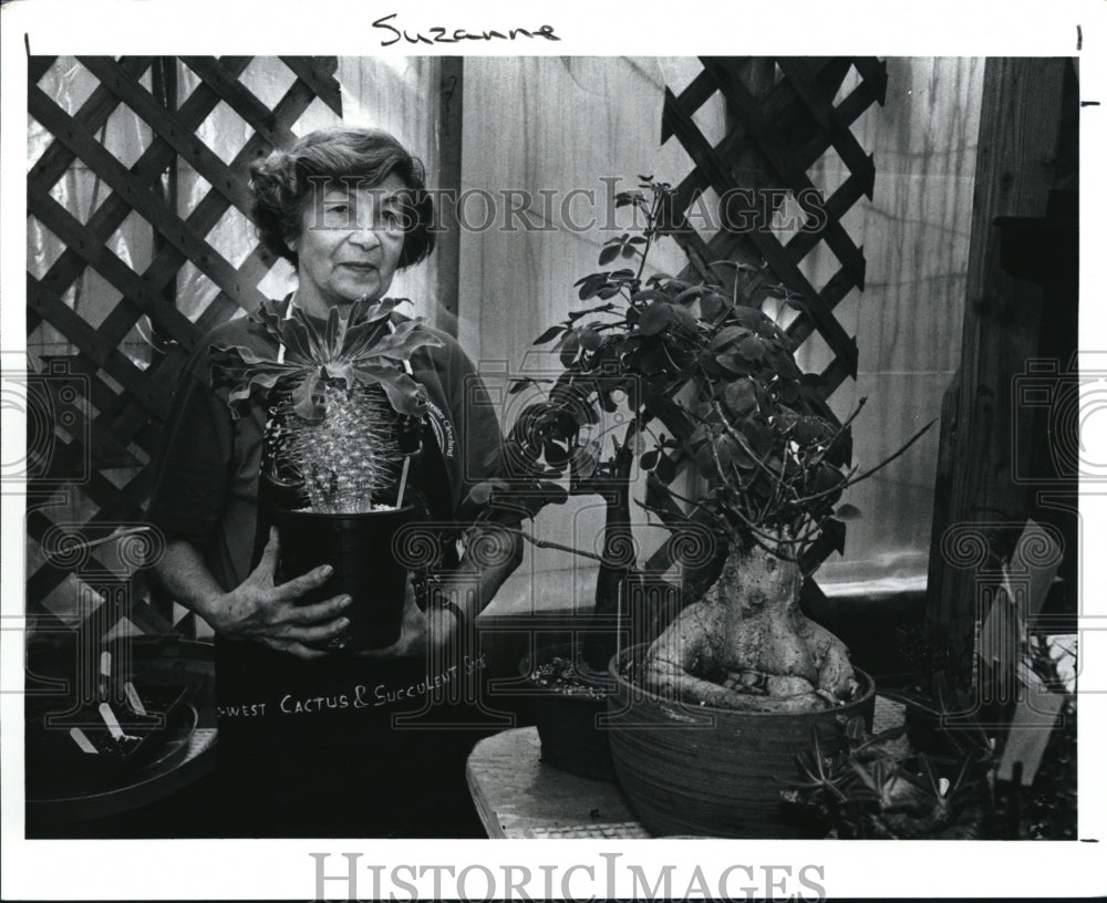 1991 Press Photo Penny Chaikin with cactus plants.- Historic Images