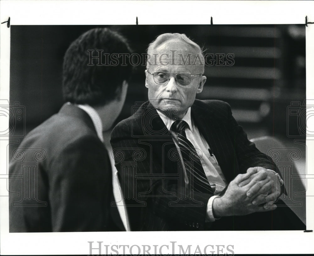 1987 Press Photo Rear Adm. Eugene J. Carroll Jr. talks to a St. Ignatius teacher- Historic Images