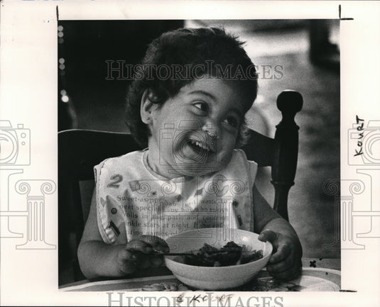 1991 Press Photo Kourtaney Collins plays faces with her mother - Historic Images