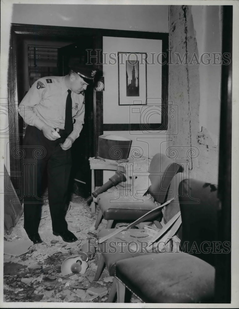 1953 Press Photo Lt. Ed Cisar surveys damages of the Dr. Lawrence's office- Historic Images