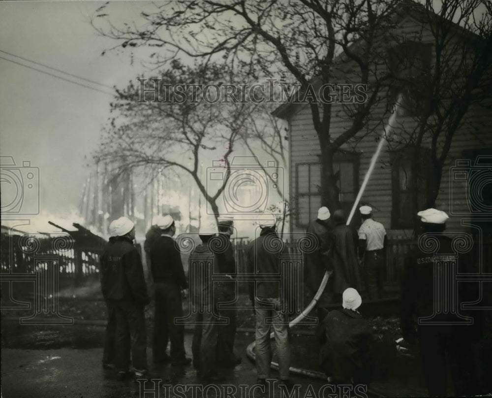 1944 Press Photo Coast guardsmen fighting flames at the home of Mary Hocevar- Historic Images