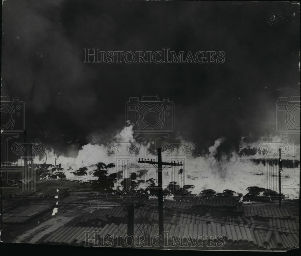 1963 Press Photo Automobiles disappearing in flames after gas tanks exploded - Historic Images