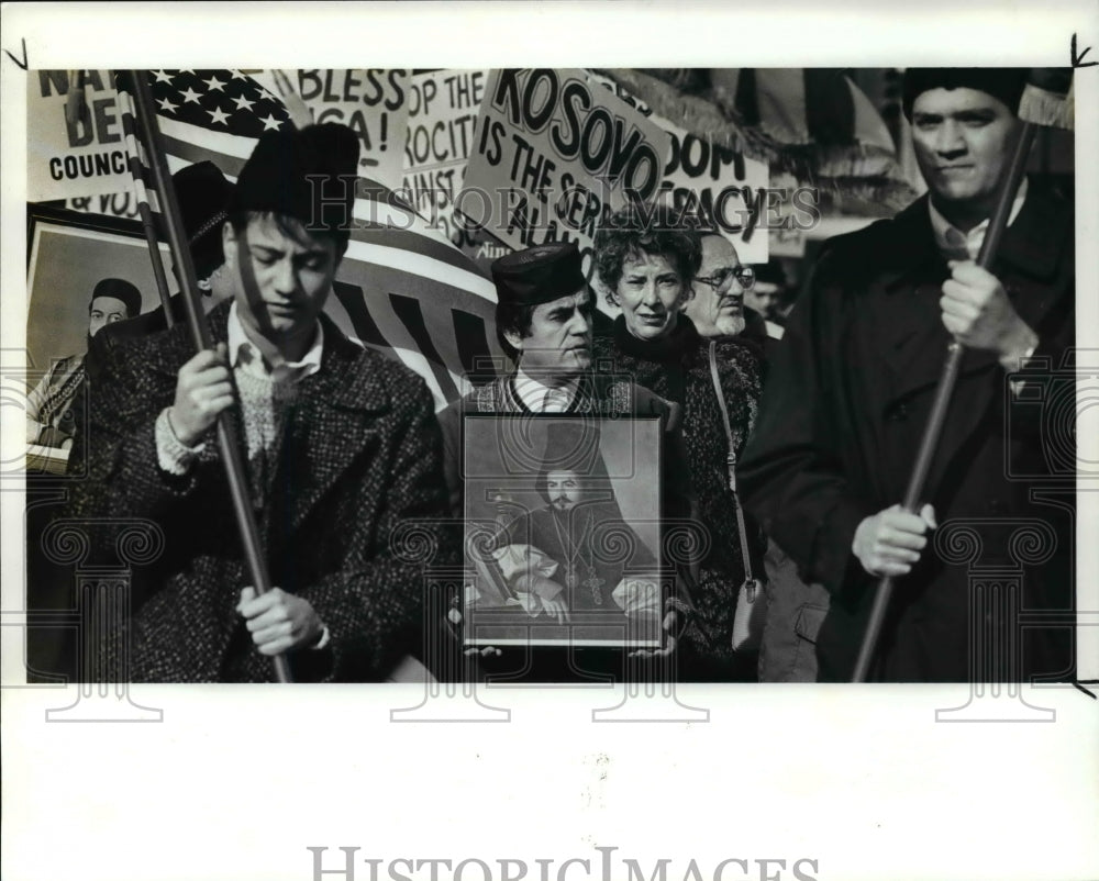 1988 Press Photo Marinko Betrovic Marches with a Portrait of Bishop Nyegosh 
- Historic Images