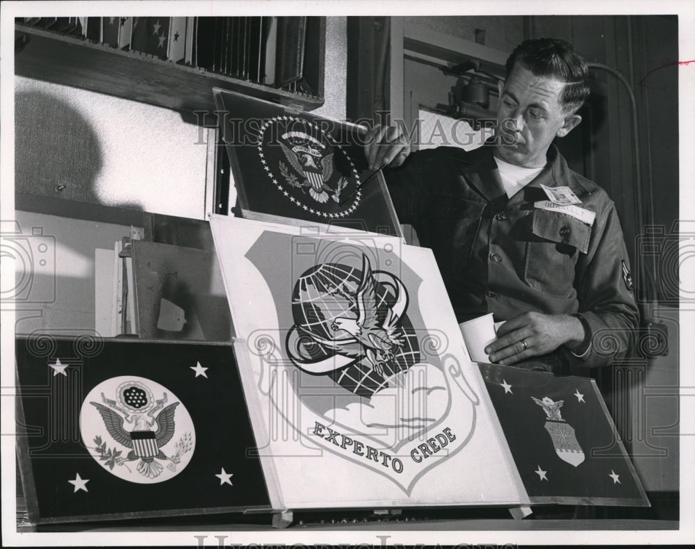 1963 Press Photo AIC Joseph Donnely shoe seals used in Air Force Air Mission.- Historic Images