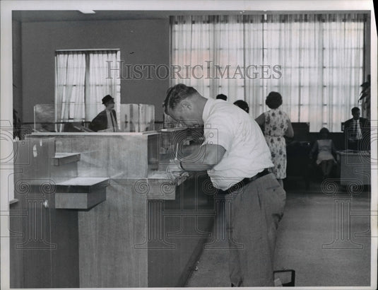 1965 Press Photo Police checking fingerprints in teller of Cuyahoga Saving Assn.- Historic Images