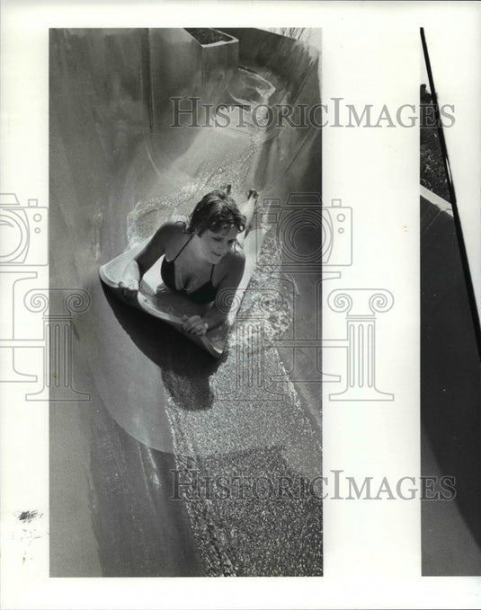 1985 Press Photo Enjoying the water slide - cvb08095- Historic Images