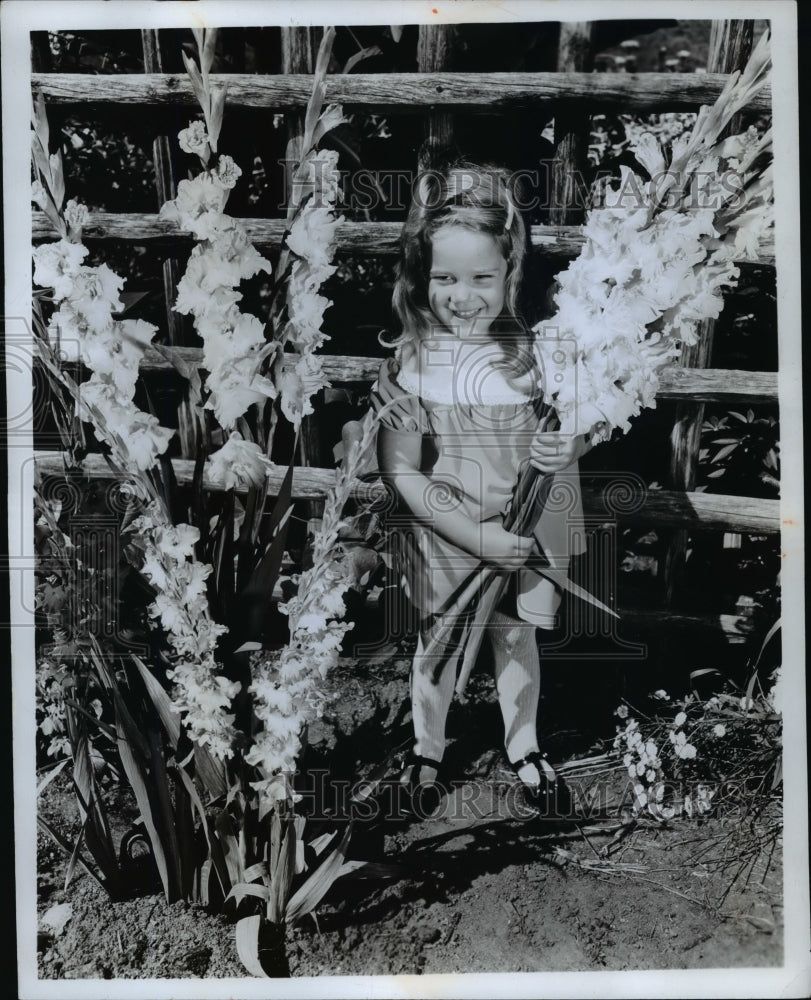 1969 Press Photo Girl holding Flowers &amp; Plants &quot;Gladiolus&quot;- Historic Images