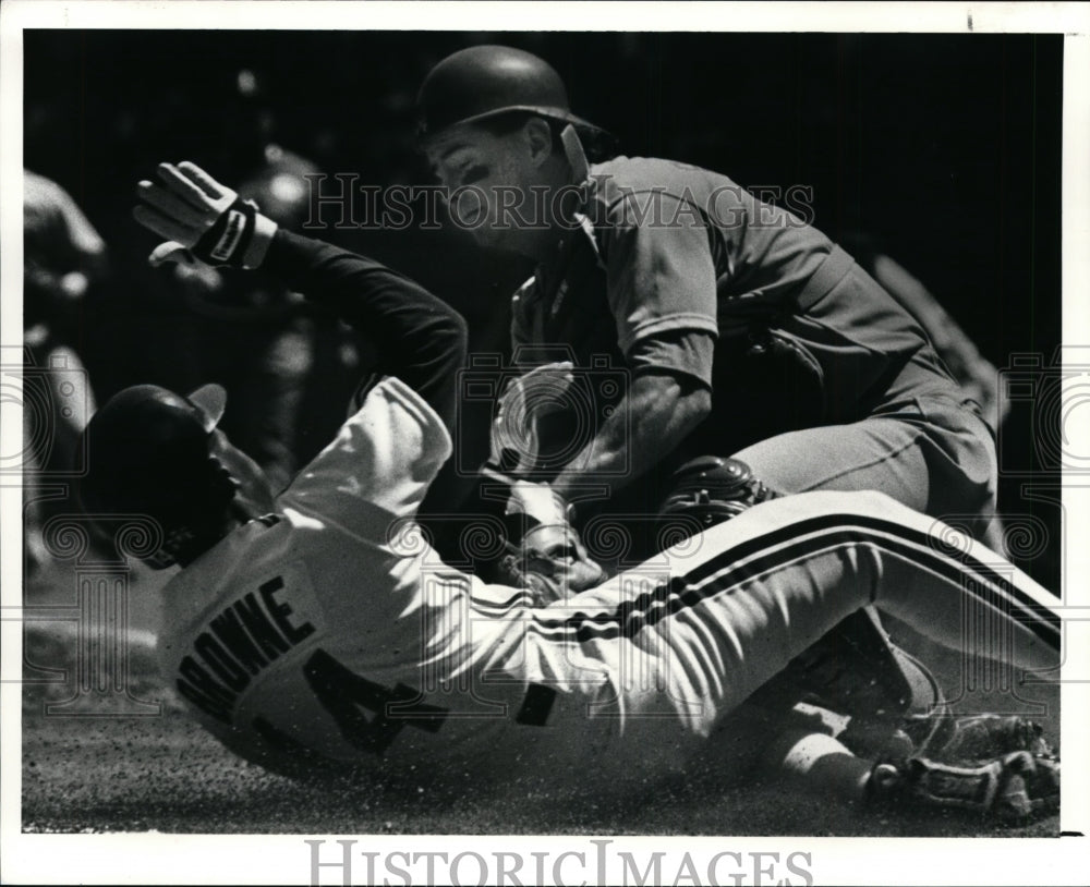 1990 Press Photo Jerry Browne slides in safe at home under the tag of texas- Historic Images