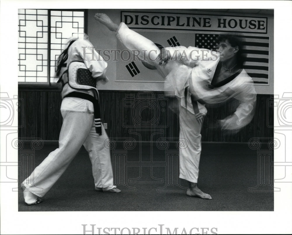 1990 Press Photo Joe Kim sweeps a kick over Mike Mignona 's head - cvb35547- Historic Images