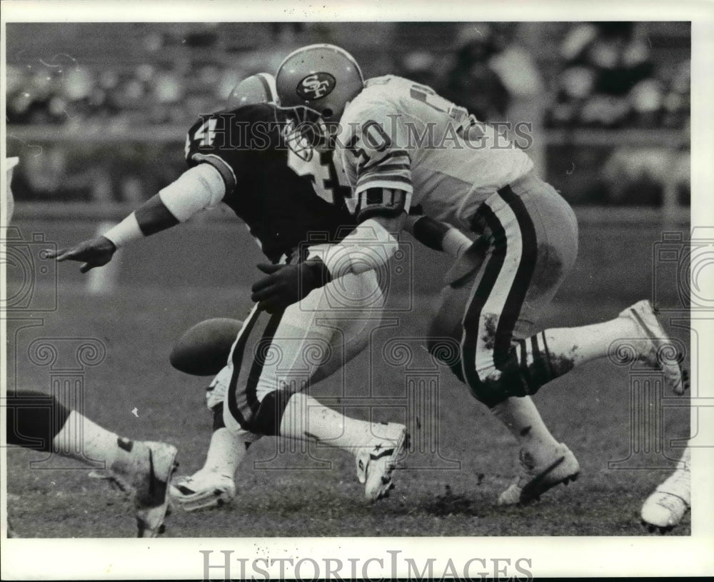 1984 Press Photo Browns Ernest Byner is hit by Riki Ellison and fumbles the ball- Historic Images