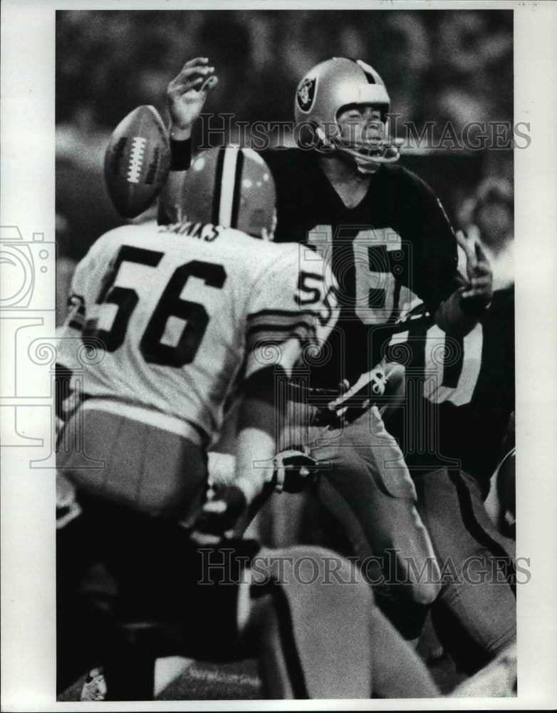 1983 Press PhotoJim Plunkett was hit from behind by the Browns knocking the ball- Historic Images