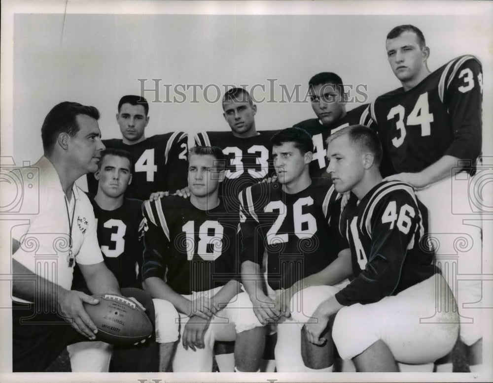 1961 Press Photo Two backfields greet John Ray as football equipment- Historic Images