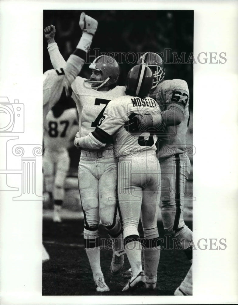 1987 Press Photo Jeff Gosset, Mark Moseley and Cody Risien celebrate winning.- Historic Images