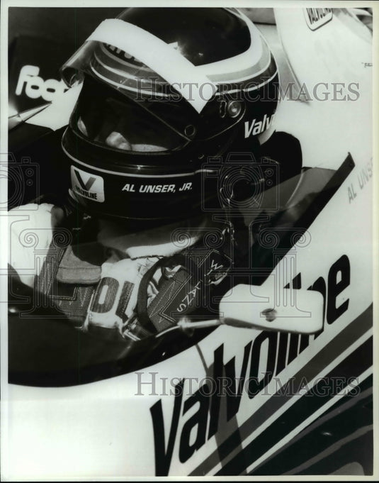 1988 Press Photo Team Valvoline driver Al Unser Jr. sits in the cockpit of