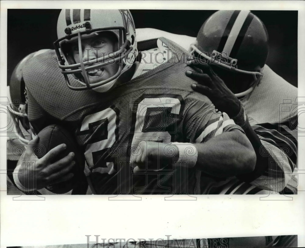 1981 Press Photo Rob Carpenter vs Rob Goode-football action scene - cvb65467- Historic Images