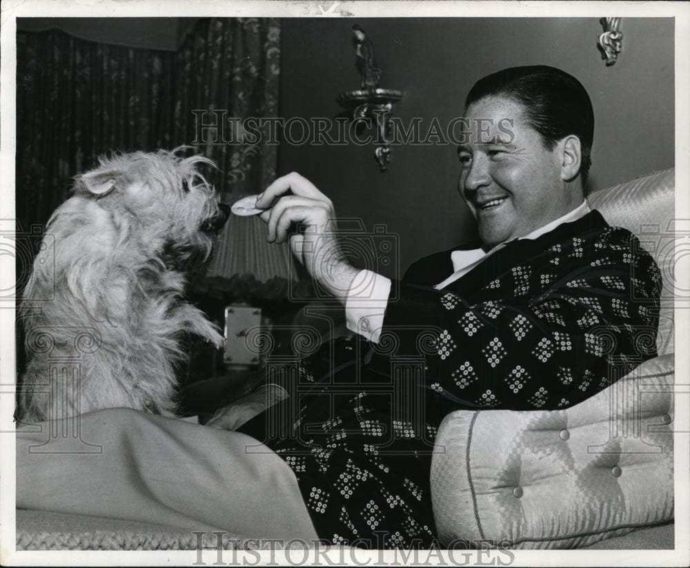 1941 Press Photo Jack Oakie, comedian, relaxes with his dog Bonnie. - cvp88128- Historic Images