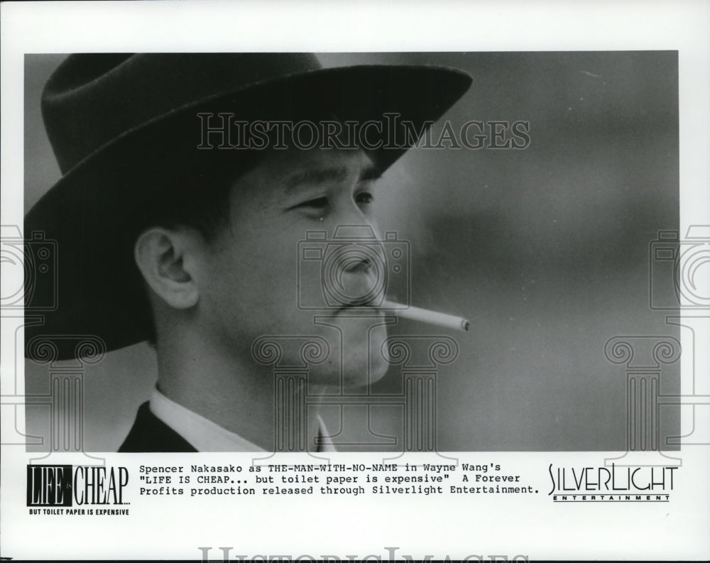 1991 Press Photo Spencer Nakasako stars in &quot;Life Is Cheap...but toilet paper is- Historic Images