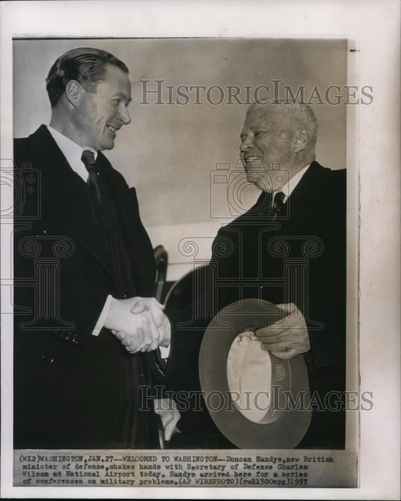 Load image into Gallery viewer, 1957 Wire Photo Sandys shake hands with Sec. Wilson at National Airport
