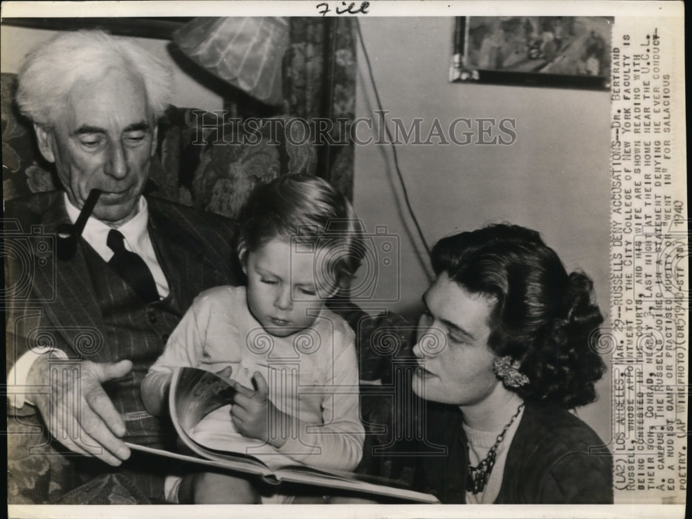 1940 Press Photo Bertrand Russell and wife read to their son in their L.A. home.- Historic Images