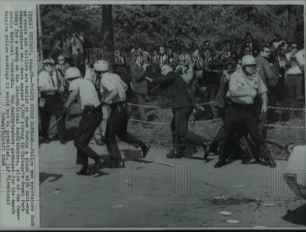 1968 Press Photo Police Dodge Rocks and Bottles thrown by demonstrators- Historic Images