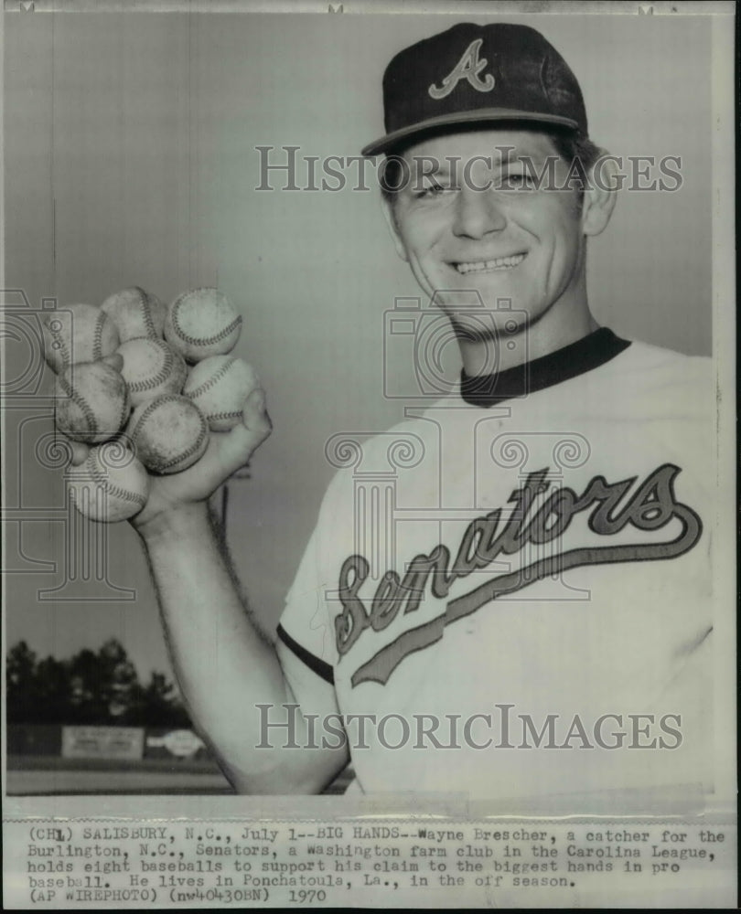 1970 Press Photo Wayne Brescher, holds eight baseballs to support pro baseball- Historic Images