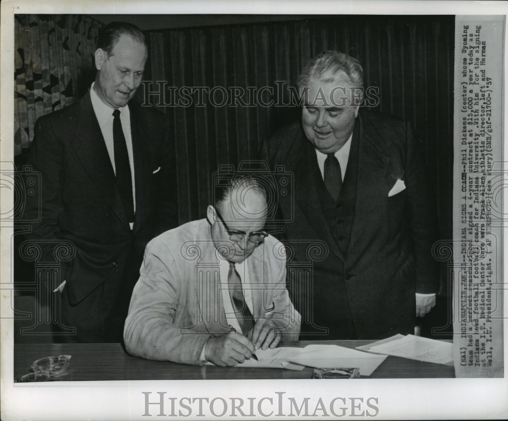 1957 Press Photo Phil Dickens, signs contract as head coach for Indiana Univ- Historic Images