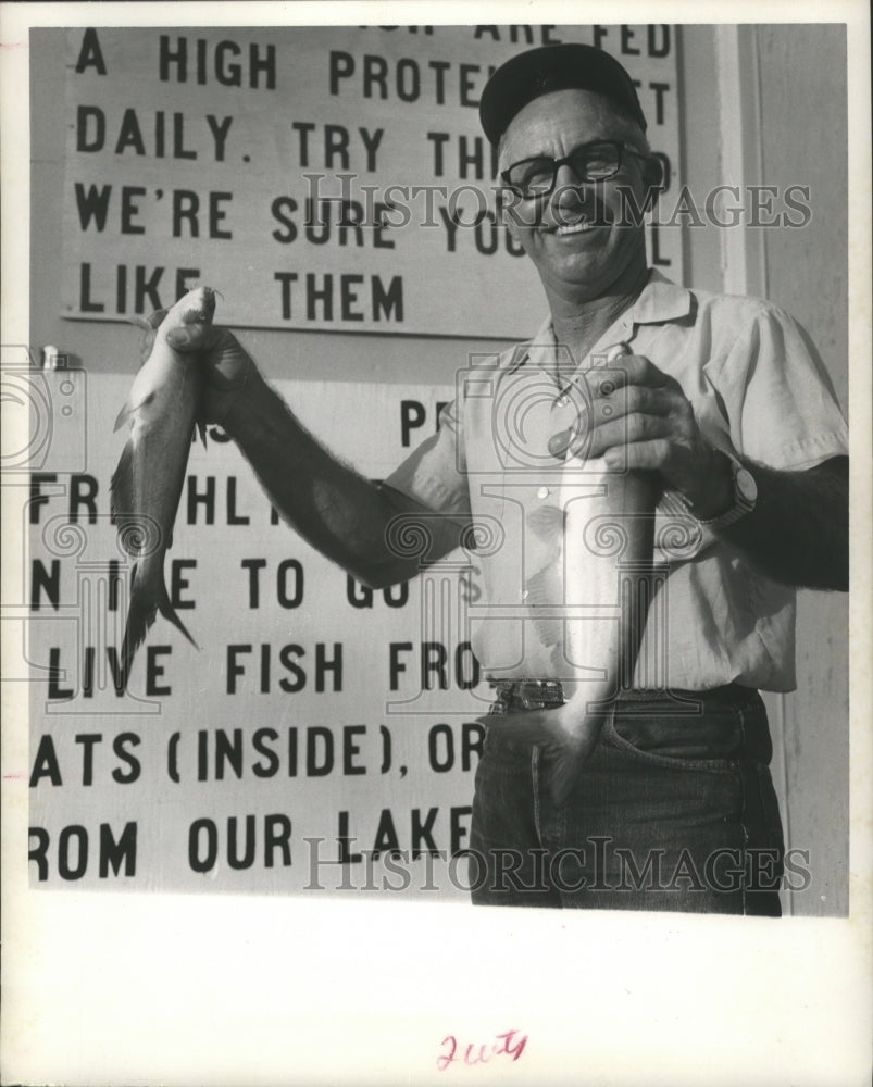 1972 Press Photo Clarence Zwahr Catfish Farmer Showing Off Prize Catch.