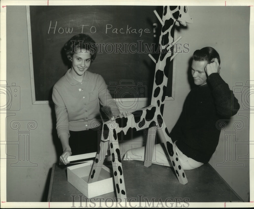1962 Press Photo Houston Jr Achievement members with giraffe coat rack