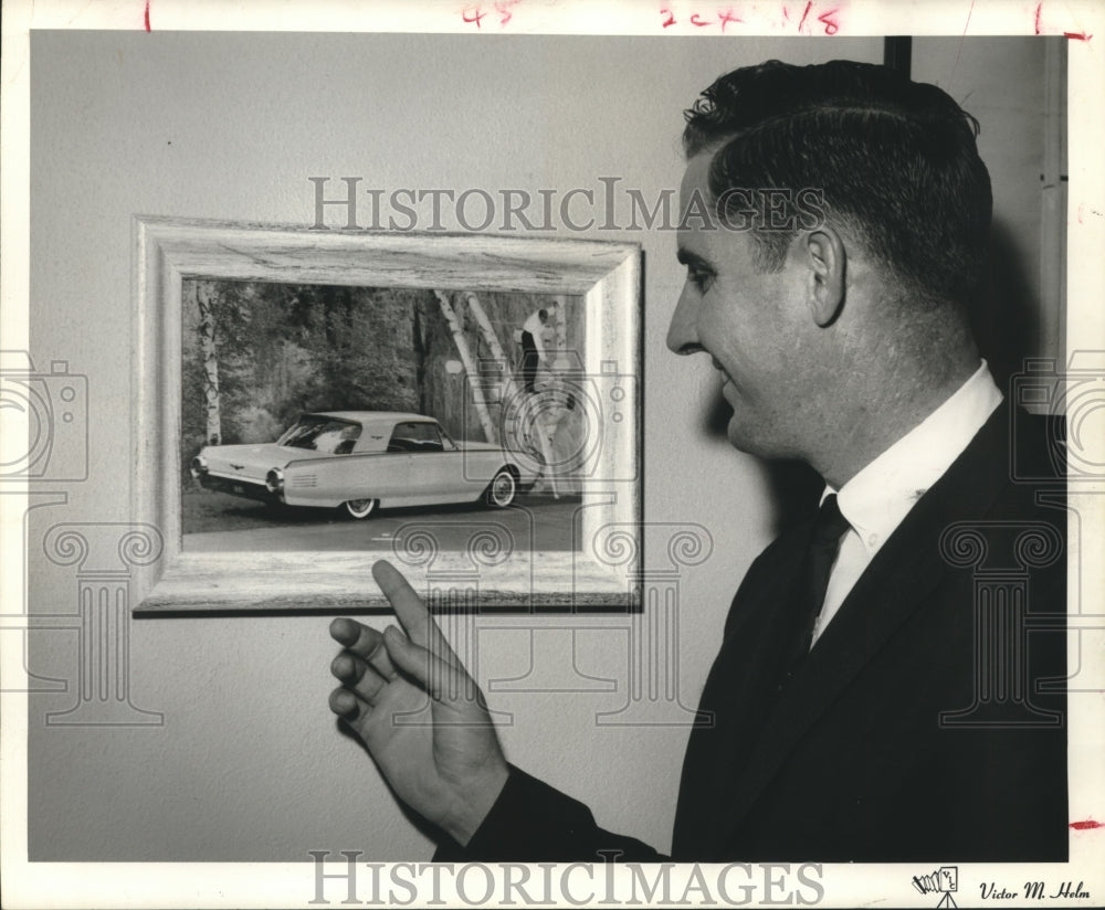 1961 Press Photo Brent Cole views drawing in Houston Ford dealership - hca39301