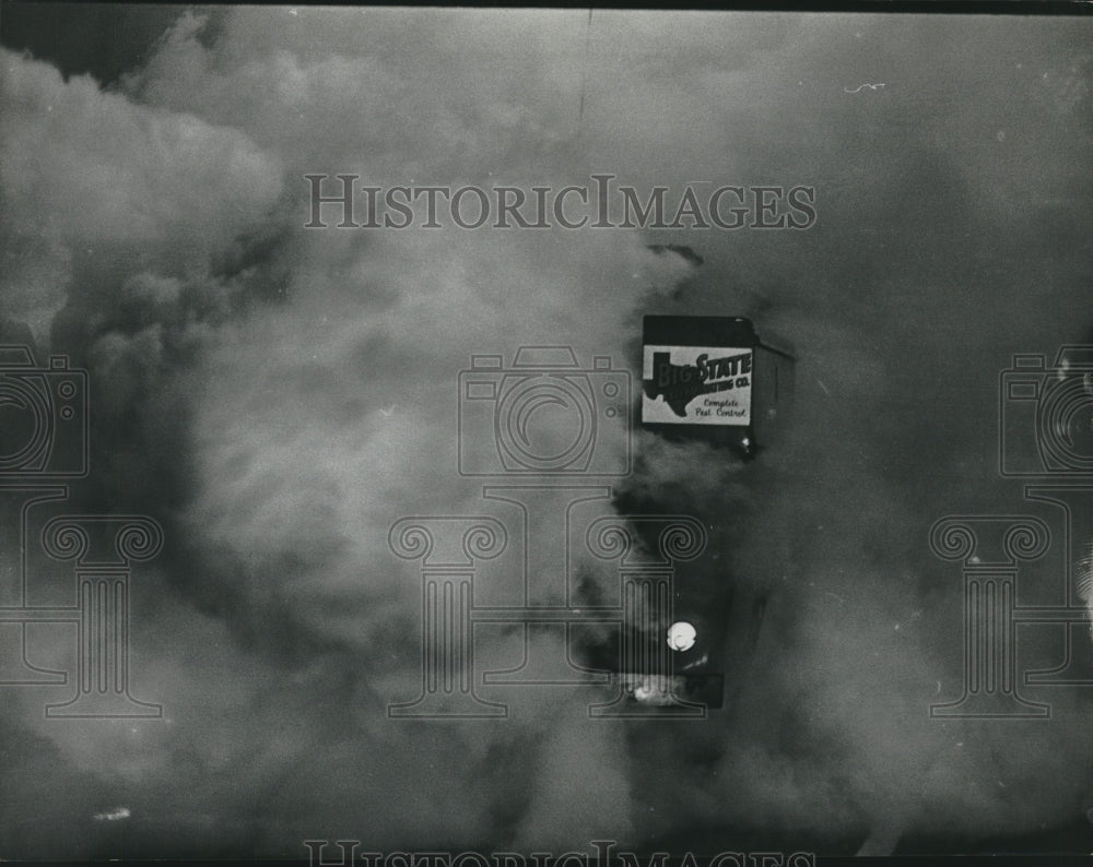 1964 Press Photo Building peeking out through mosquito fog, Houston, Texas