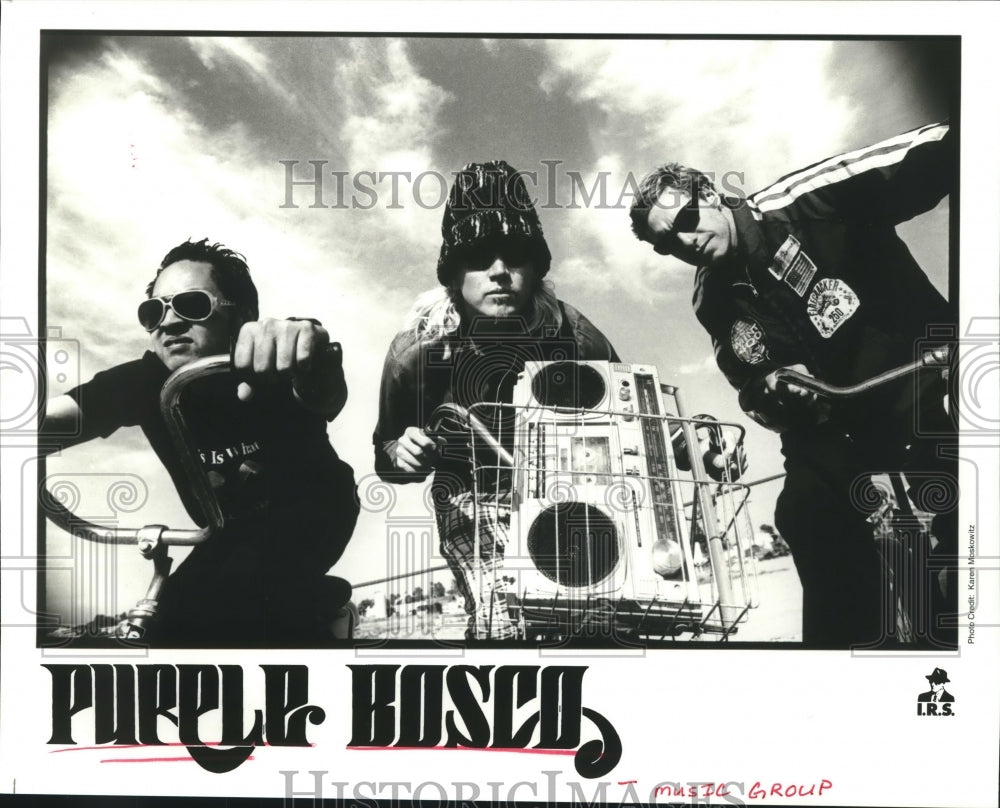 1995 Press Photo Members of group Purple Bosco on bikes with boom-box- Historic Images