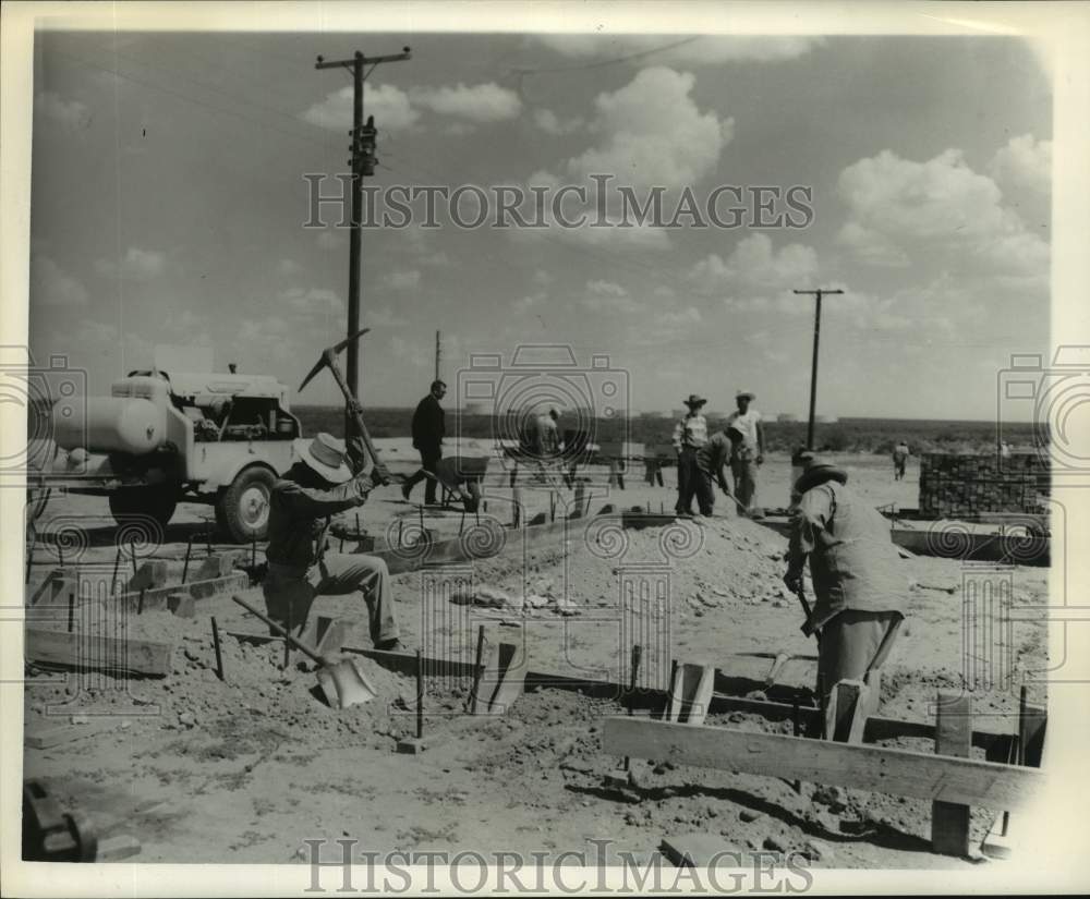 1961 Press Photo Employees Doing Ground Work for Duplex Building In Wink, Texas- Historic Images