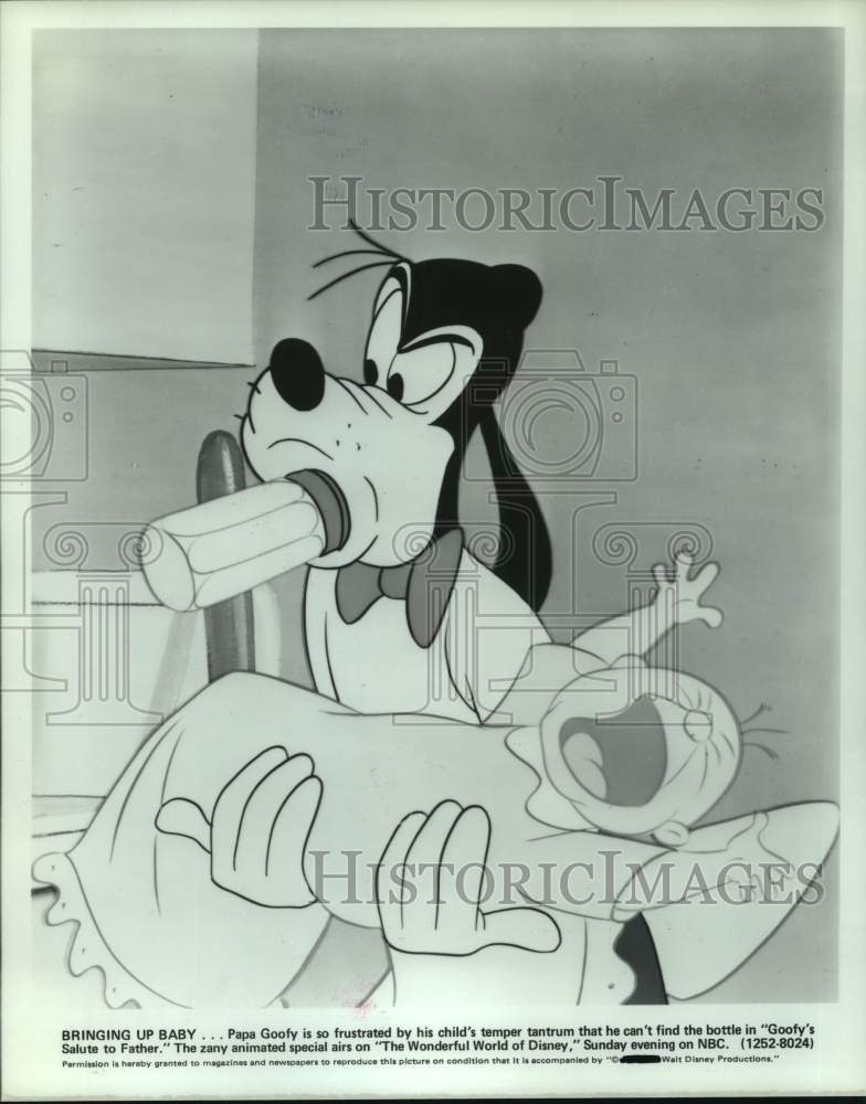 1979 Press Photo Trying to calm baby in scene from &quot;Goofy&#39;s Salute to Father&quot;- Historic Images