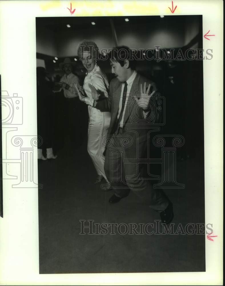 1989 Press Photo Ginger Bell & Yuki dancing at Houston Rodeo event - hca62379- Historic Images