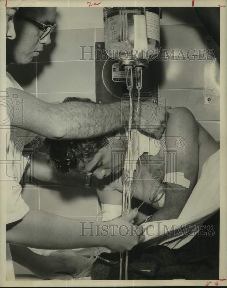 1961 Press Photo Gunman Warner Brown wounded in duel with law - hca73893