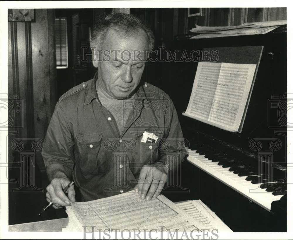 1986 Press Photo Composer George Butt writing music - hca77892- Historic Images