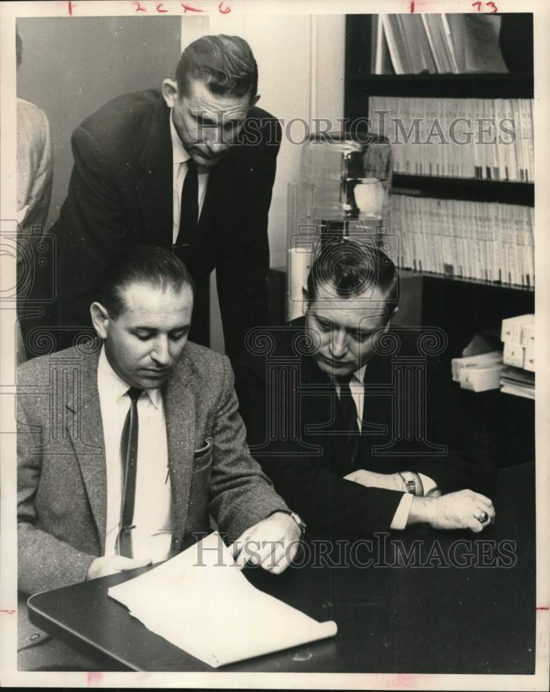 1961 Press Photo Asst. D. A. Walt Carr checks poll lists - hca78221