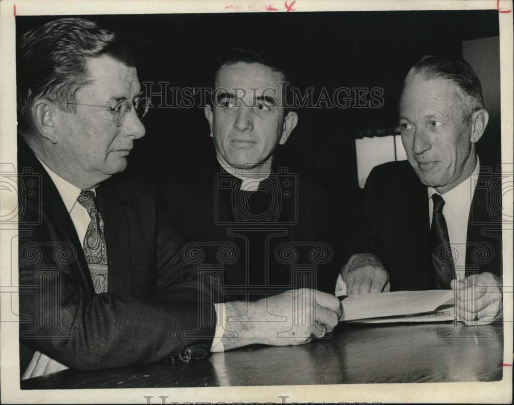 1966 Press Photo Senior wardens and rector study new parish membership list