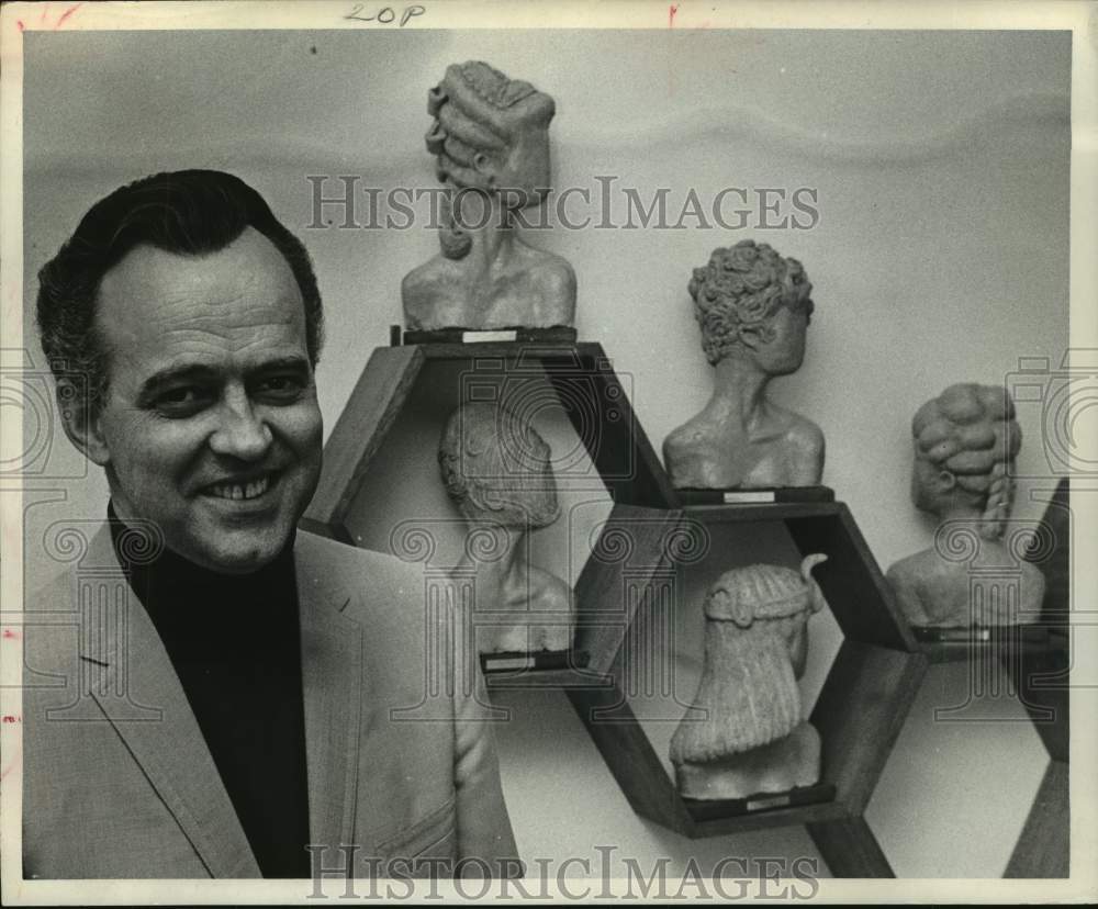 1967 Press Photo W.H. Conrad with his sculptures of different hairstyles