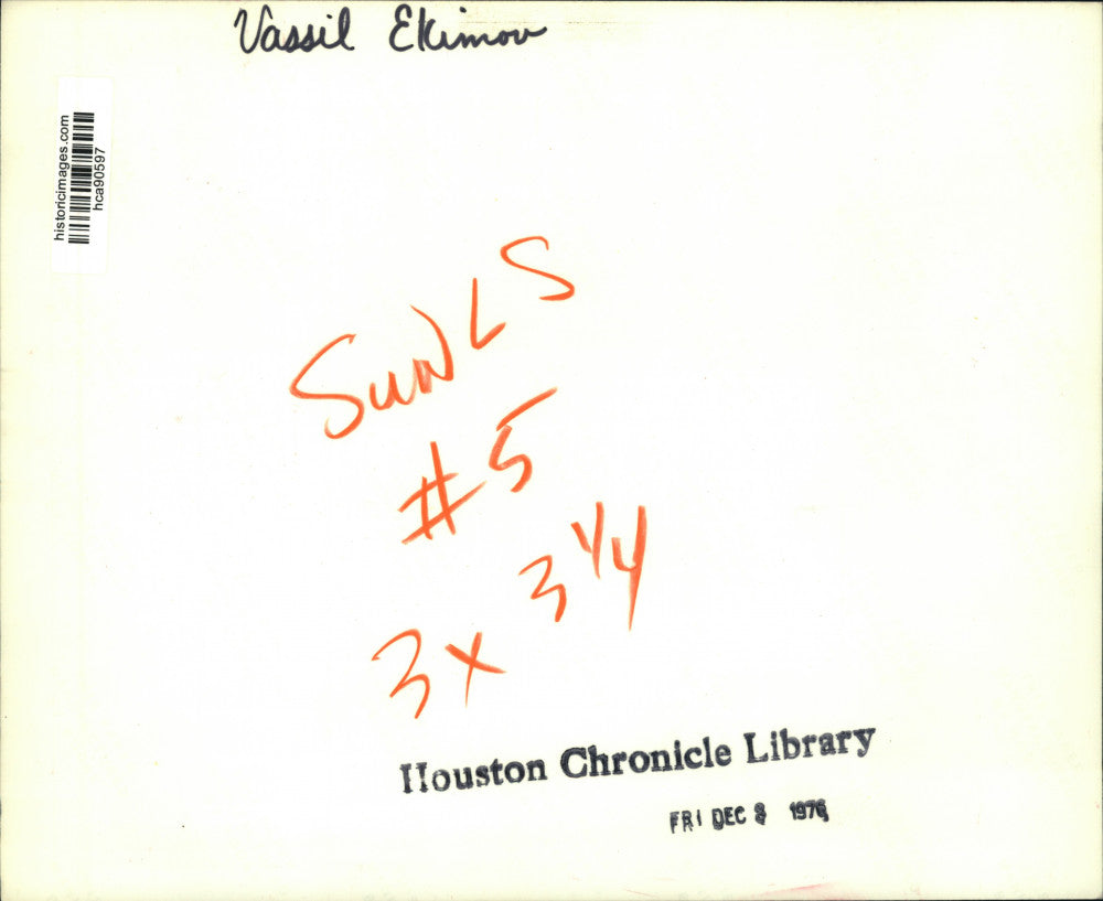 1976 Press Photo Vassil Ekimov puts medallion necklace on model - hca90597