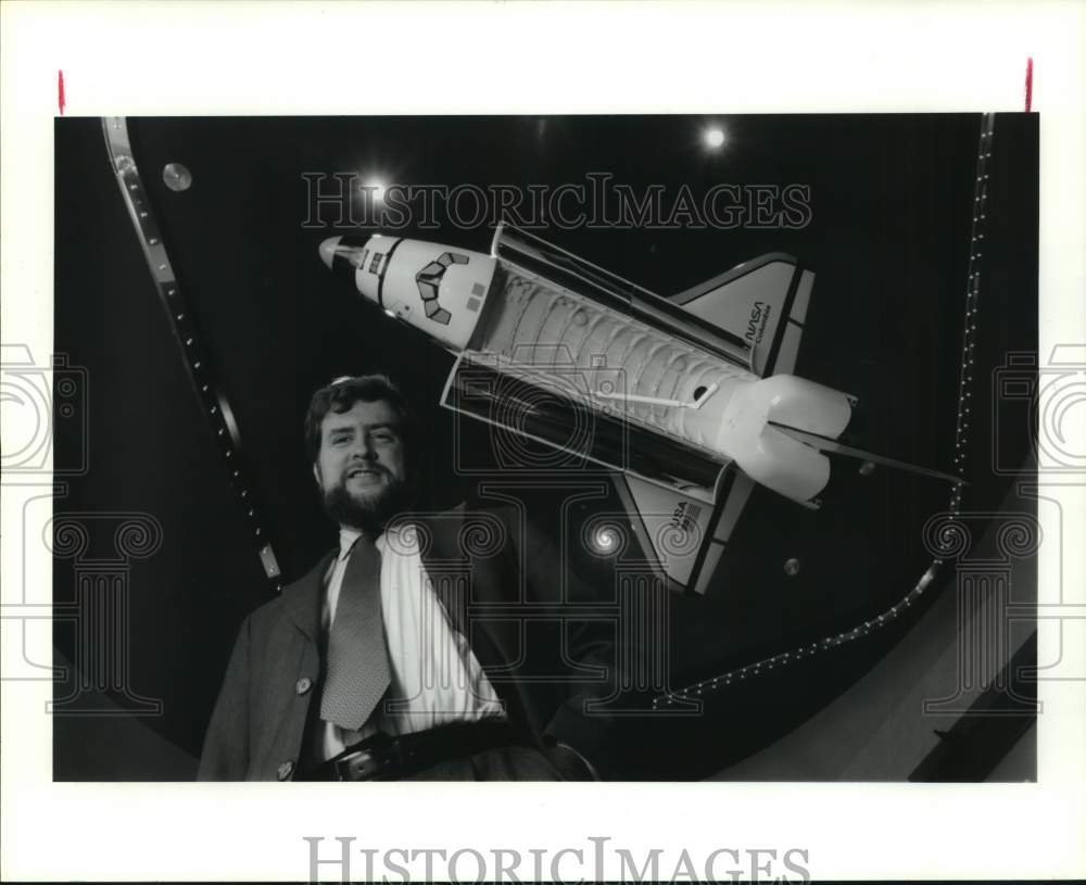 1992 Press Photo Space Industries CEO with model rocket, David Langstaff.- Historic Images