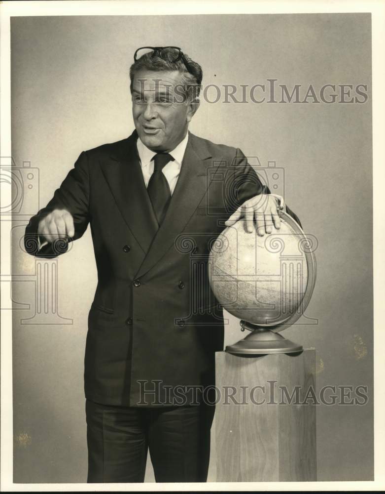 1976 Press Photo Gregory Leventis of Texas poses with globe - hcb16378- Historic Images