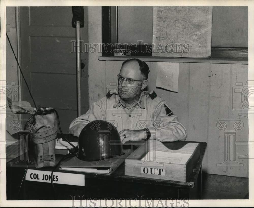 1957 Press Photo Colonel Richard Jones sits at military desk. - hcb18423