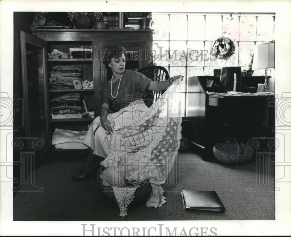 1984 Press Photo Norma Scott views old family lace in her home - hcb26233- Historic Images