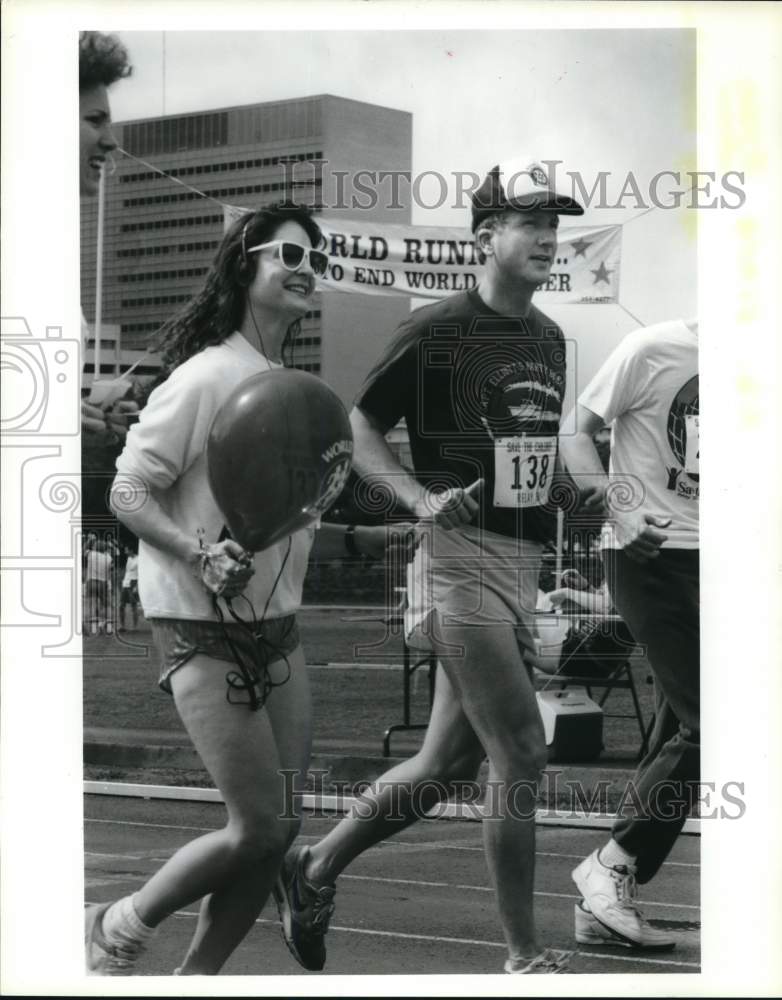 1988 Press Photo Margot Wilson runs by City Councilman Vince Ryan in run- Historic Images
