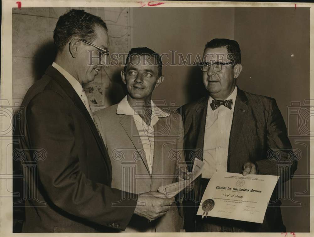 1957 Press Photo Harris County Tax Assessor-Collector Carl Smith gets citations- Historic Images