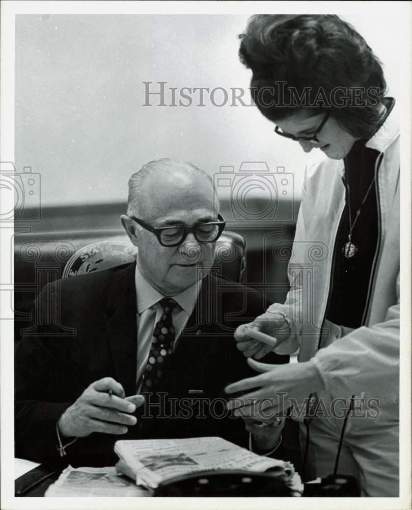 1969 Press Photo Gov. Preston Smith and woman look at stack of newspapers, Texas- Historic Images