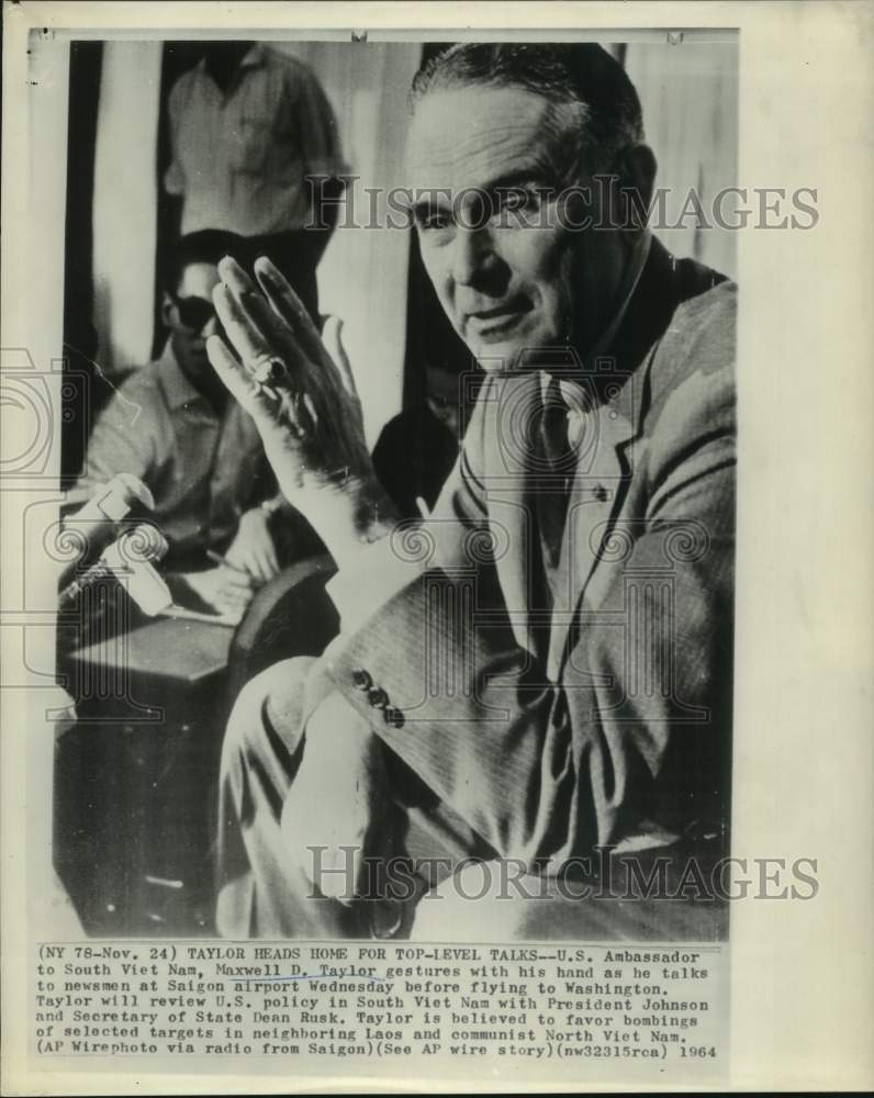 1964 Press Photo Ambassador Maxwell Taylor talks to newsmen at Saigon airport