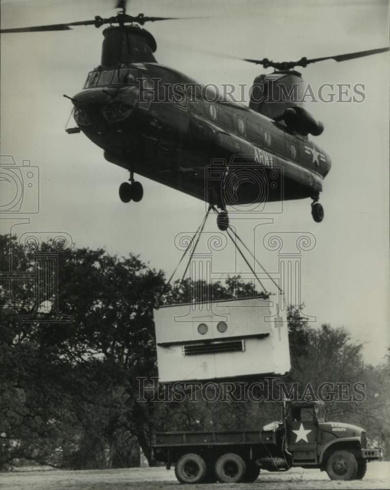 1965 Press Photo Helicopter hoists inflatable hospital; Brooke Army Medical, TX